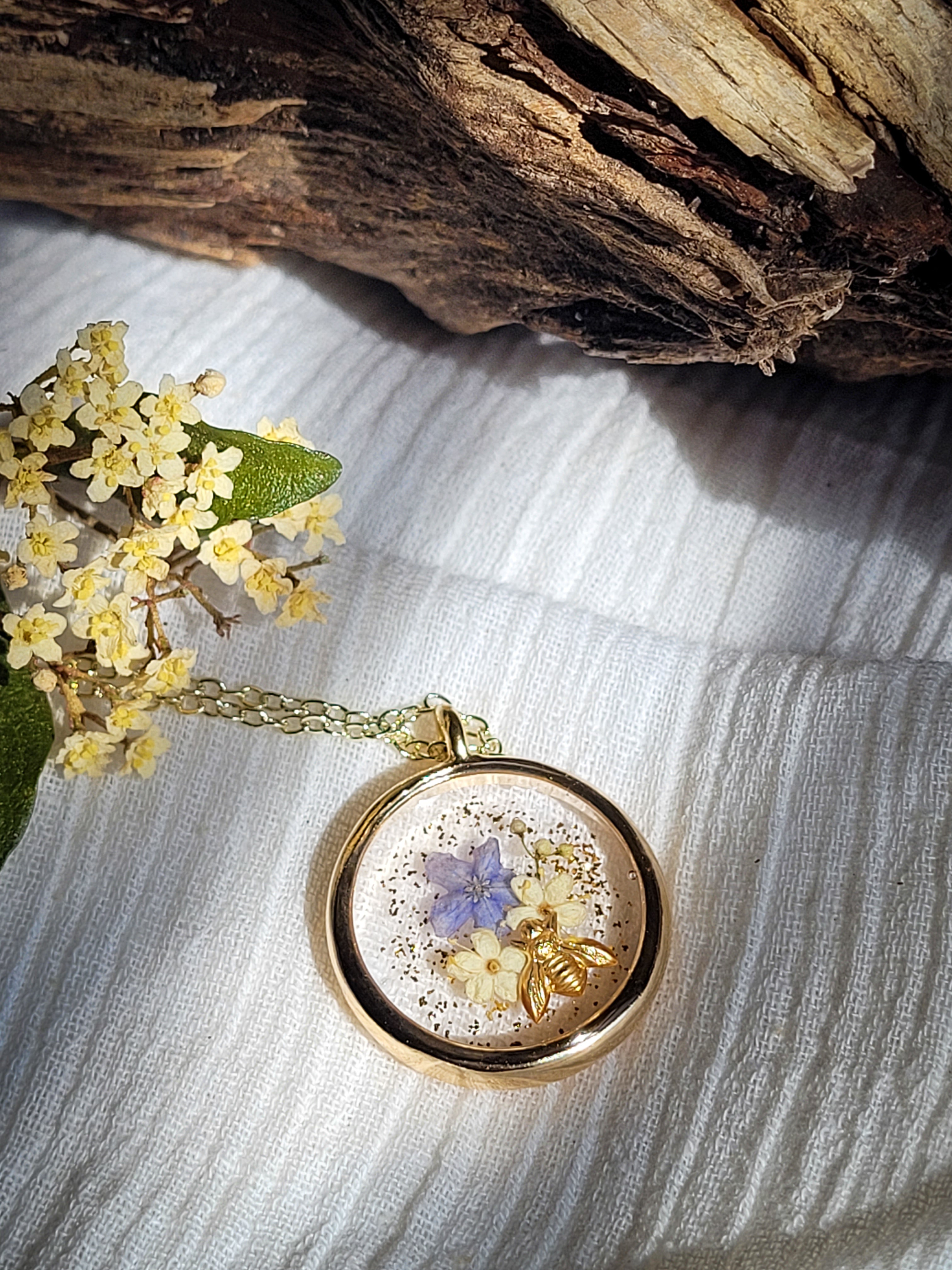 pressed flower and golden bee gold necklace